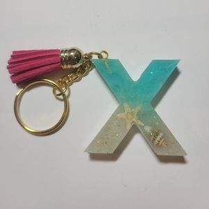Initial X beach themed key chain.